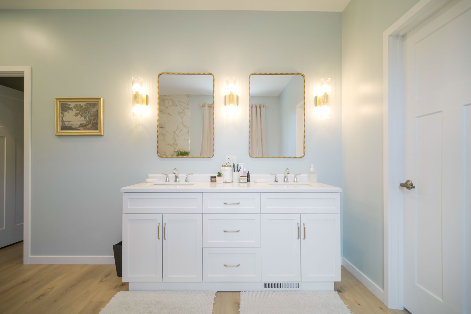 Byler Residence — double vanity with white shaker cabinetry, brass sconces, and framed mirrors — KB Builders, Central Pennsylvania