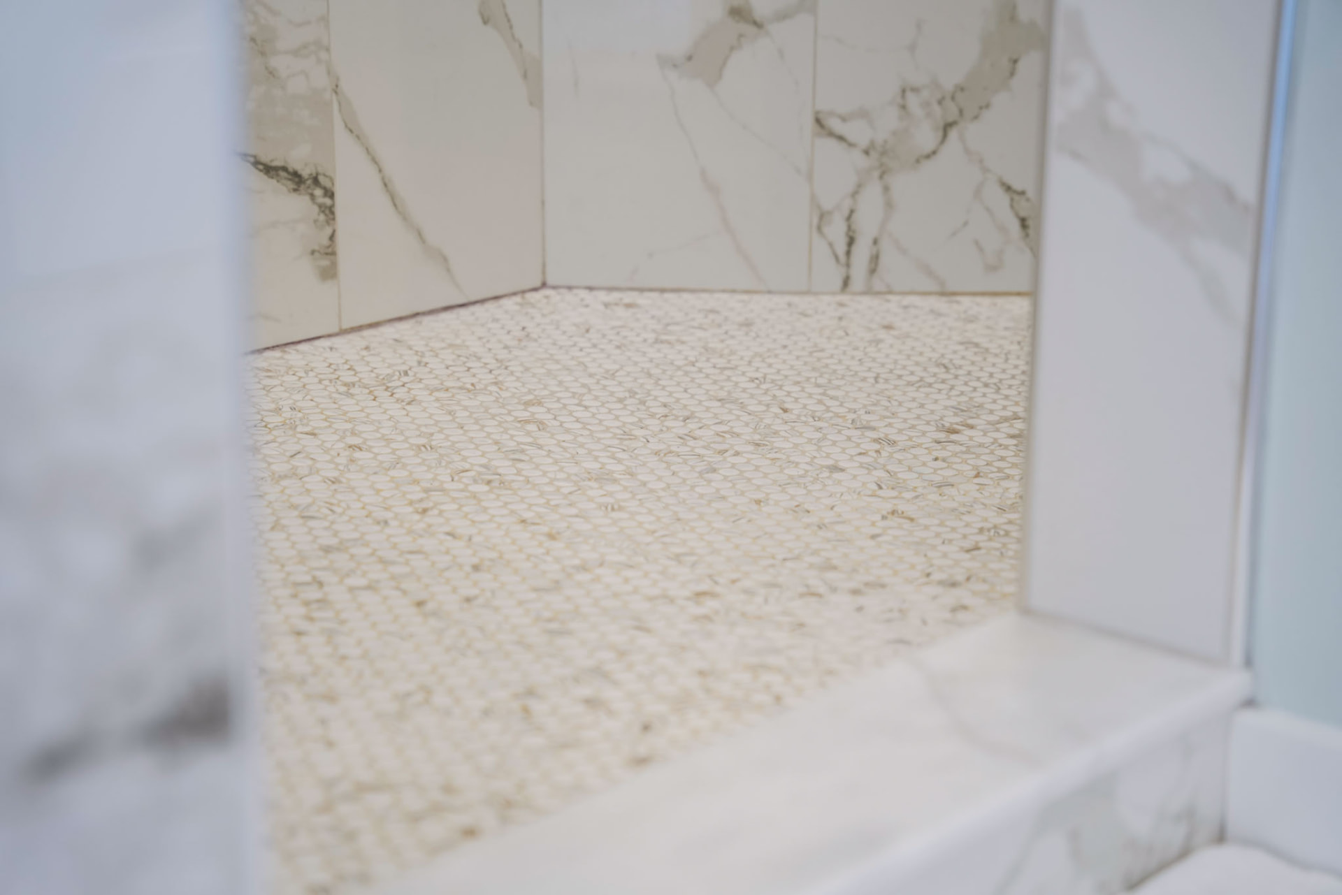 Byler Residence — walk-in shower with marble-look tile walls and pebble mosaic floor — KB Builders, Central Pennsylvania