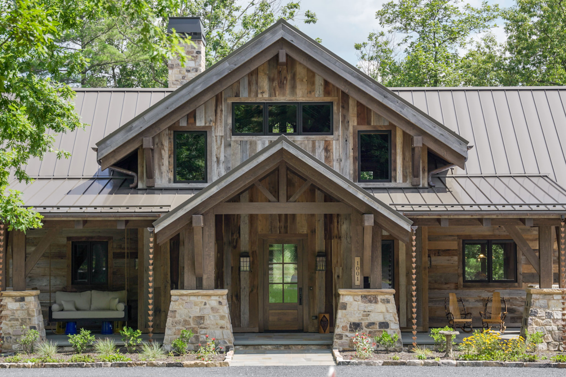 Wright Residence — straight-on front elevation with twin gables, stone piers, porch swing, and copper rain chains — KB Builders, Central Pennsylvania