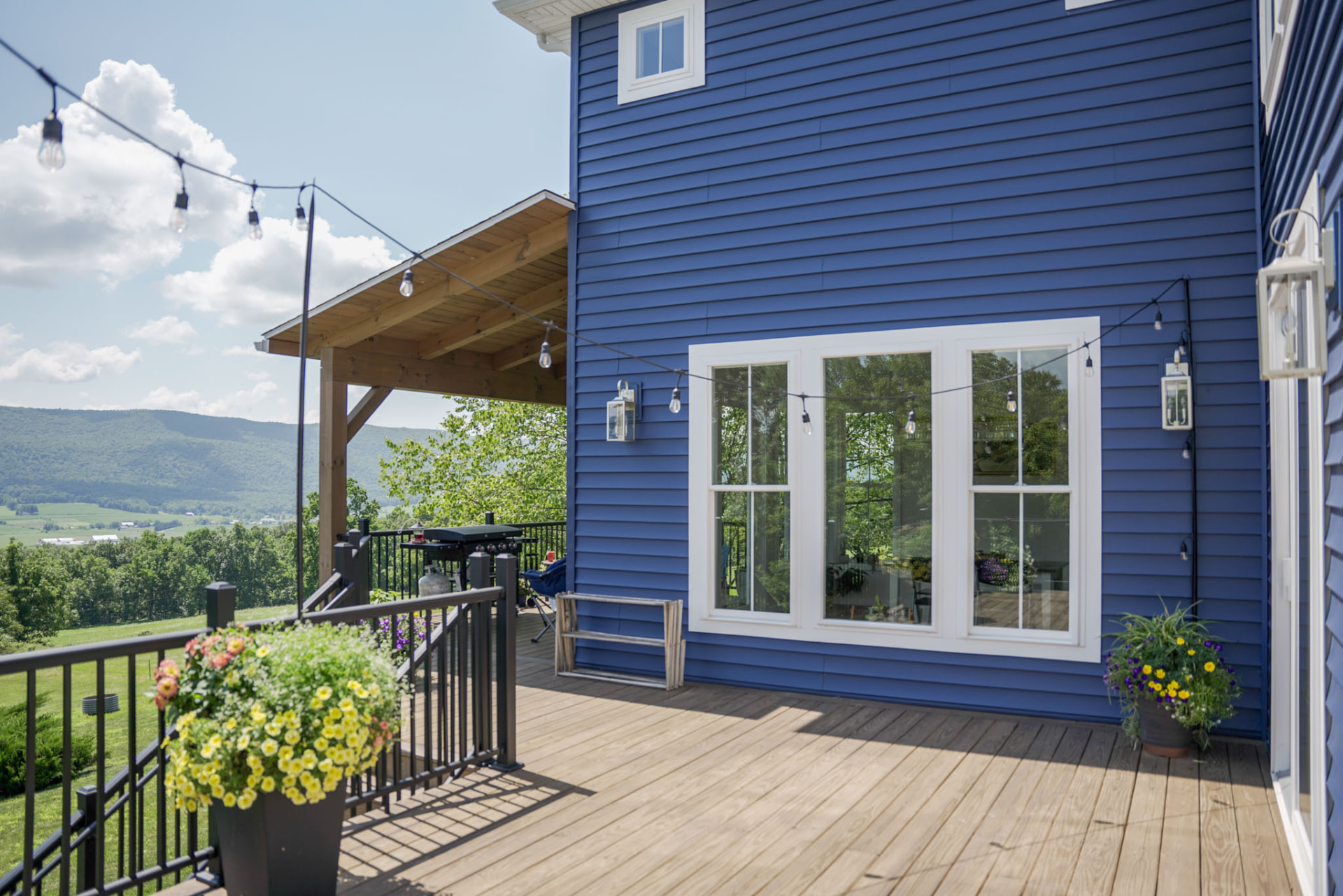 Byler Residence — rear deck with string lights, covered grill station, and mountain views — KB Builders, Central Pennsylvania