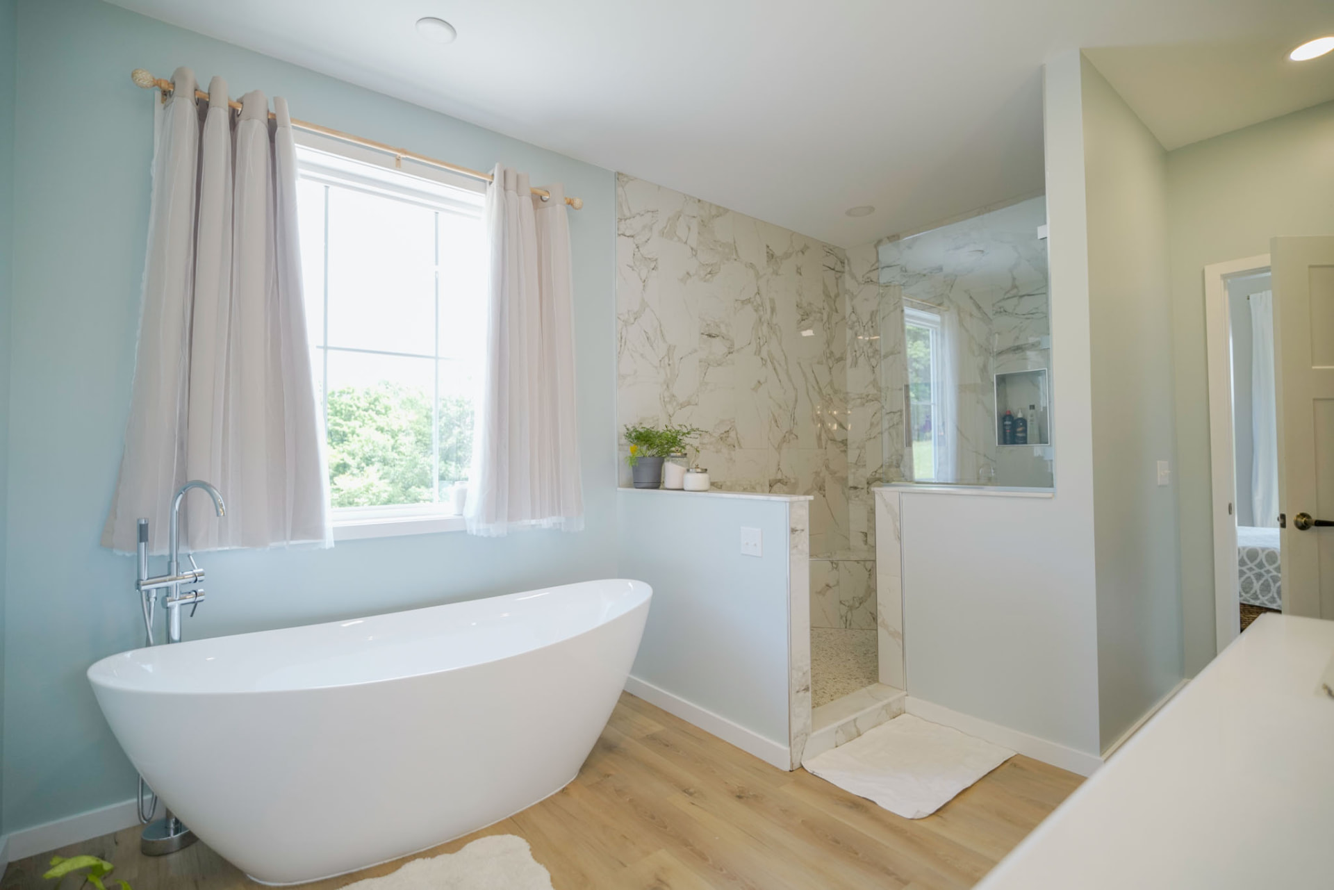 Byler Residence — primary bath with sculptural soaking tub and marble-look walk-in shower — KB Builders, Central Pennsylvania
