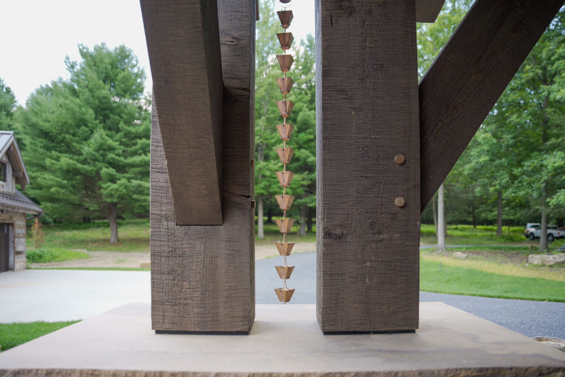 Wright Residence — copper rain chain suspended between hand-hewn timber posts — KB Builders, Central Pennsylvania