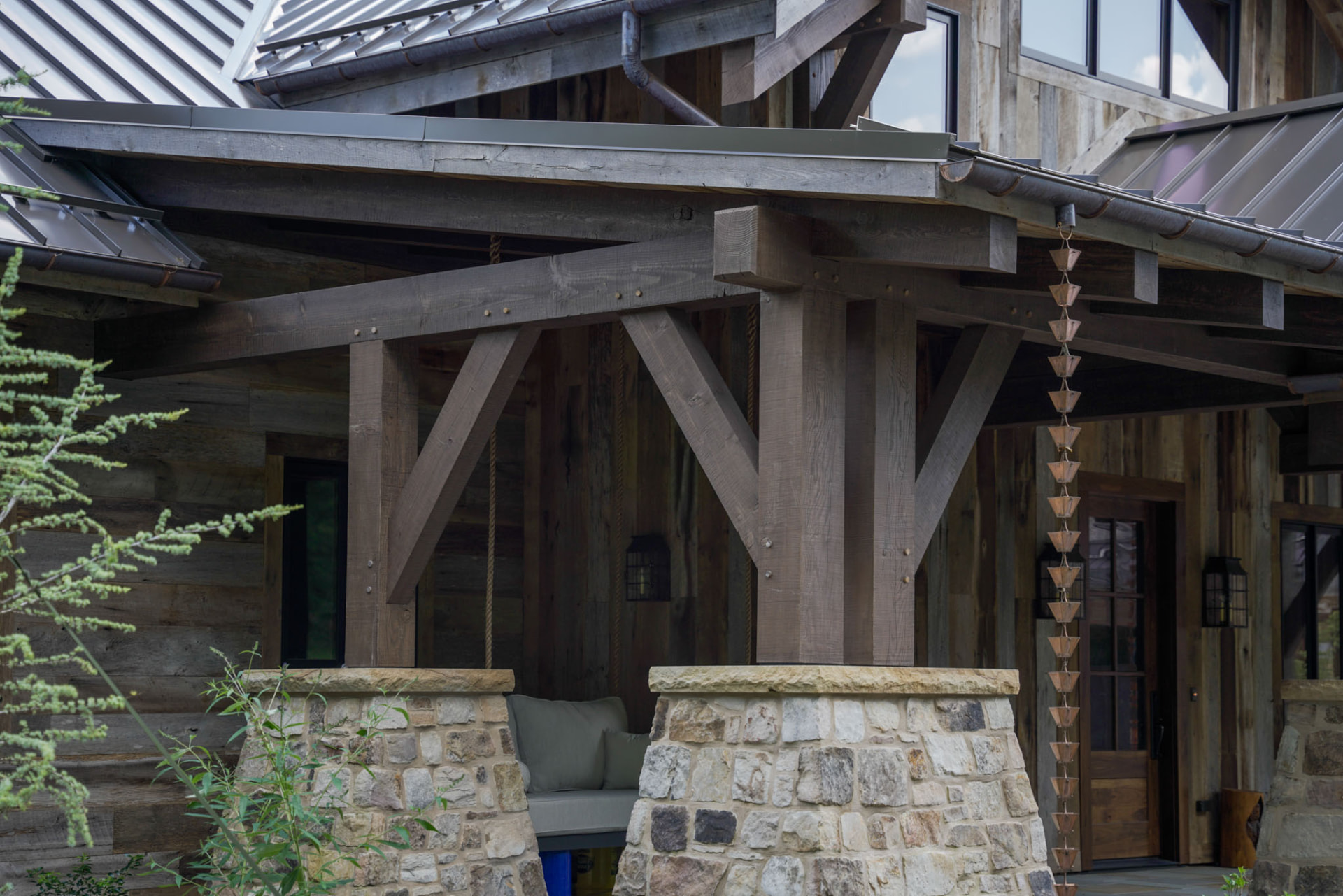 Wright Residence — hand-hewn timber joinery, copper rain chain, and stone piers at the covered porch — KB Builders, Central Pennsylvania