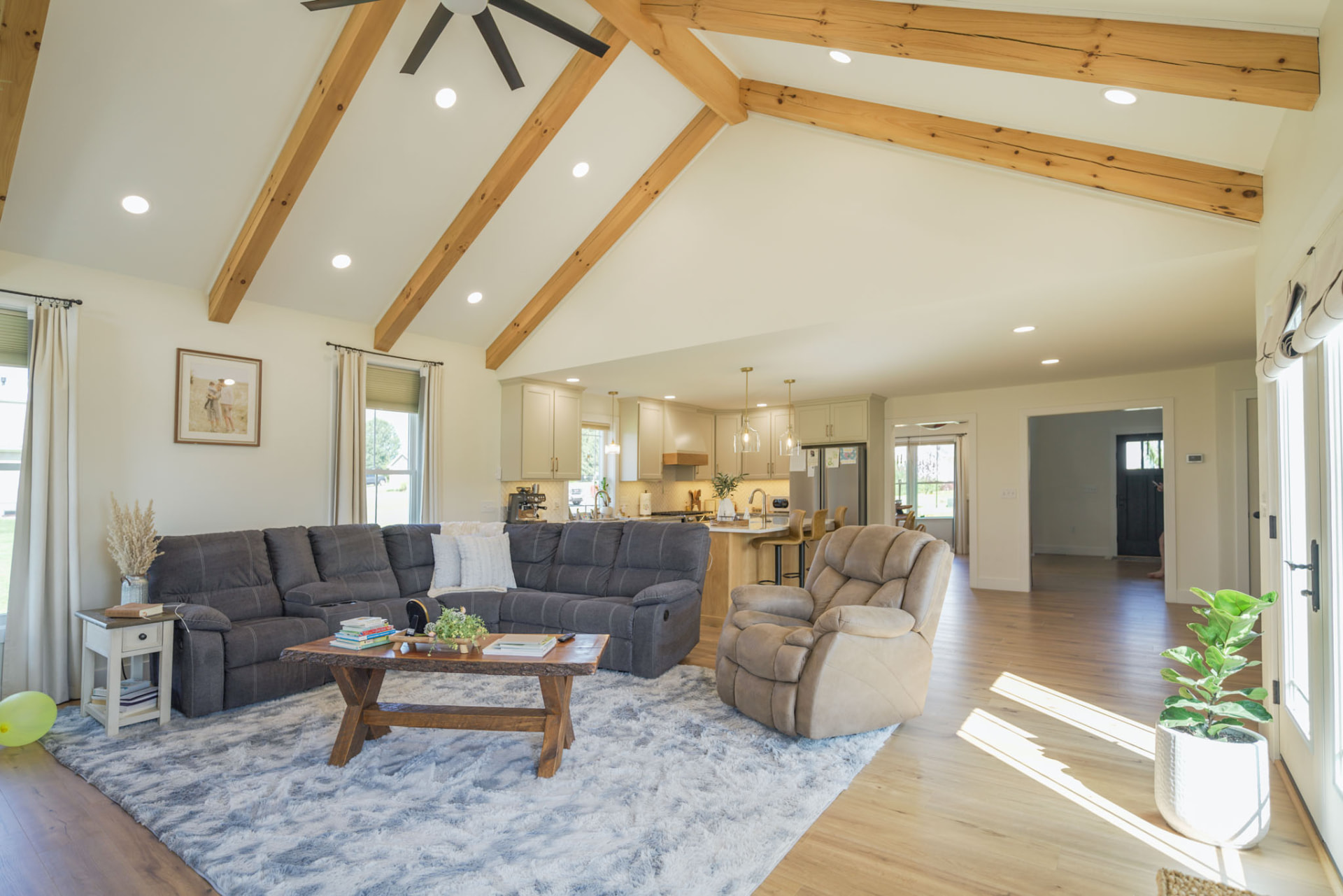 Yoder Residence — open-concept great room and kitchen under a beamed cathedral ceiling — KB Builders, Central Pennsylvania