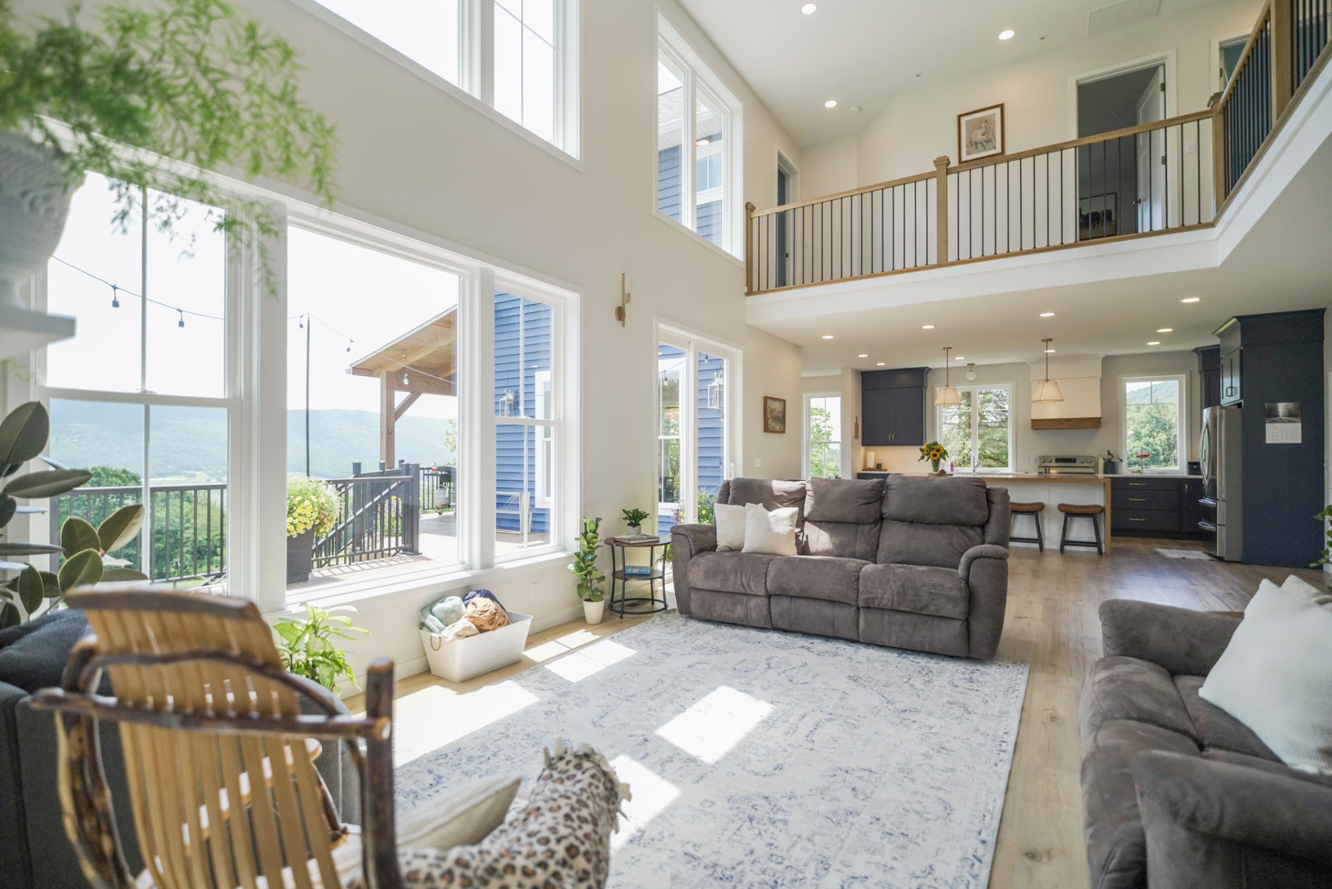 Byler Residence — two-story great room with floor-to-ceiling windows, open loft, and mountain views — KB Builders, Central Pennsylvania
