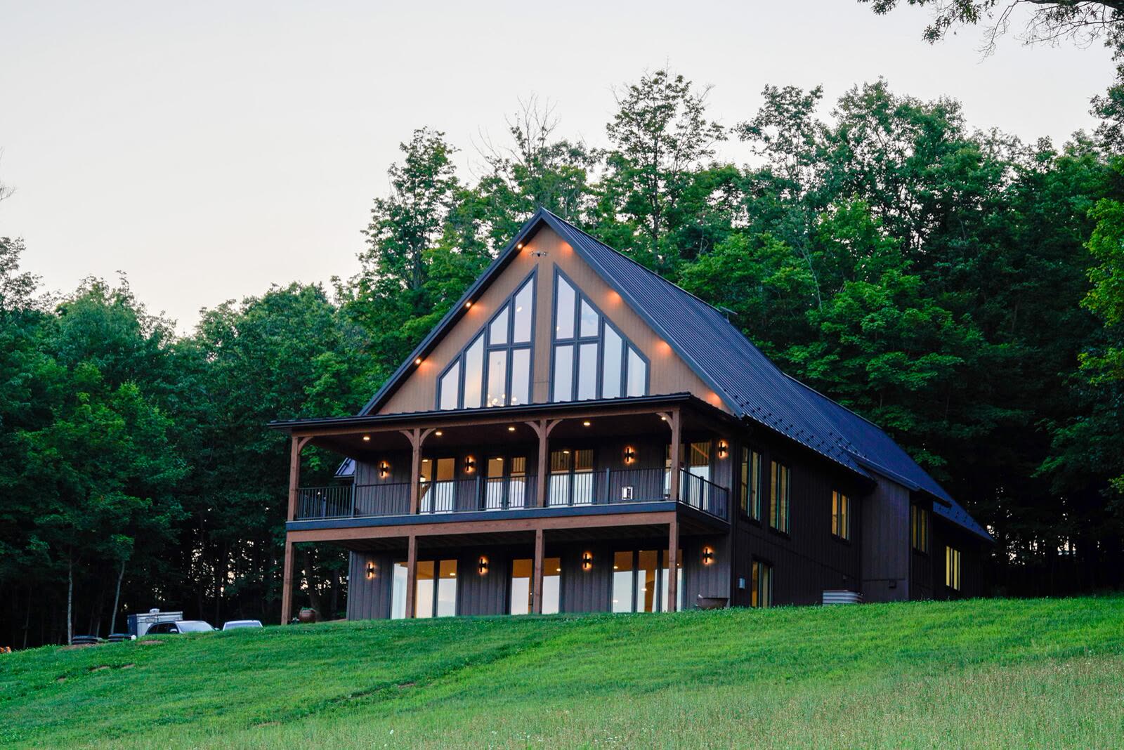 Shetler Residence rear elevation with two-story covered porch and prow-front gable — custom home by KB Builders, Mifflintown, PA