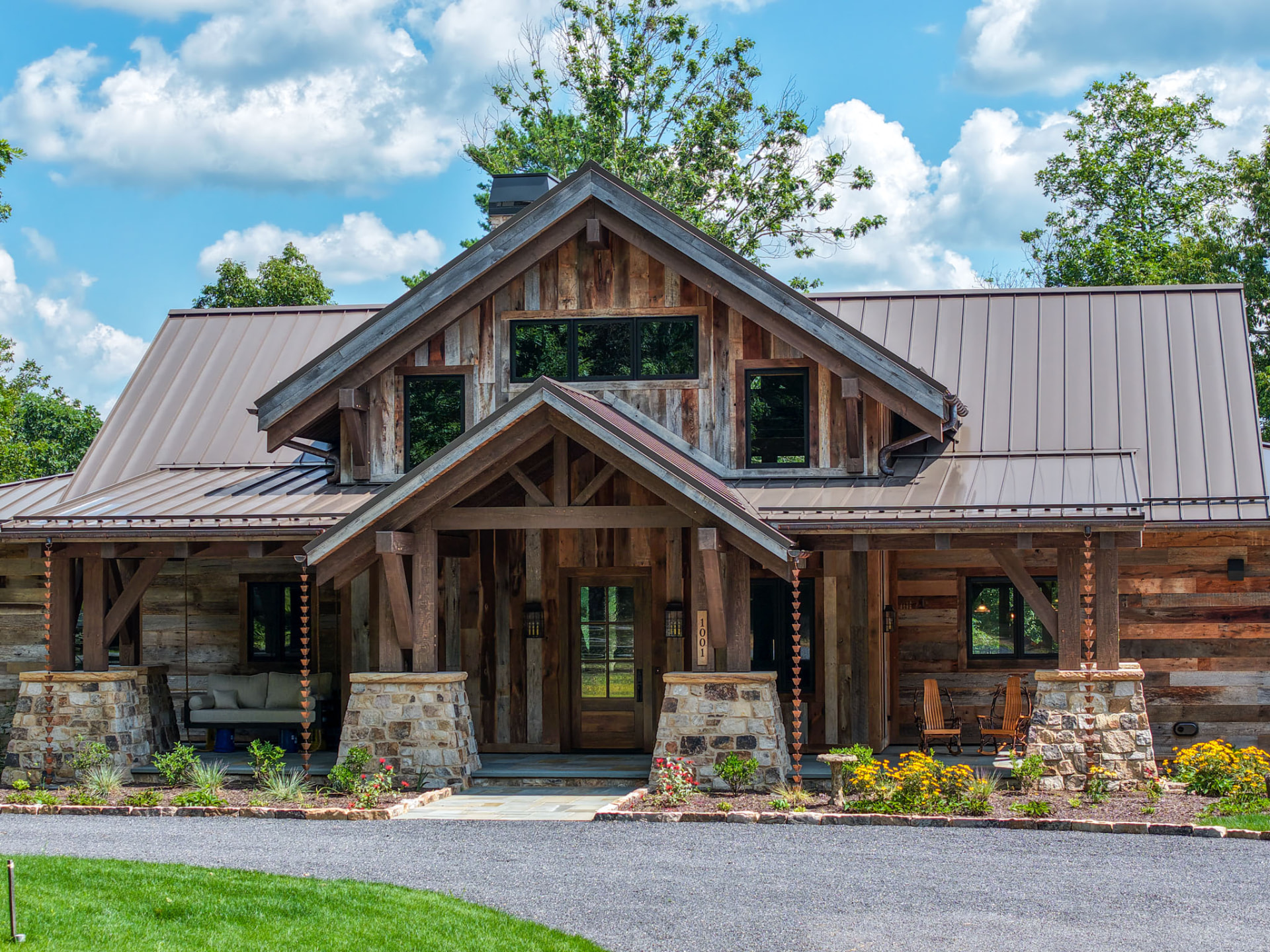 Wright Residence — timber-gabled front entry with reclaimed barnwood siding, stone piers, and copper rain chains — KB Builders, Central Pennsylvania