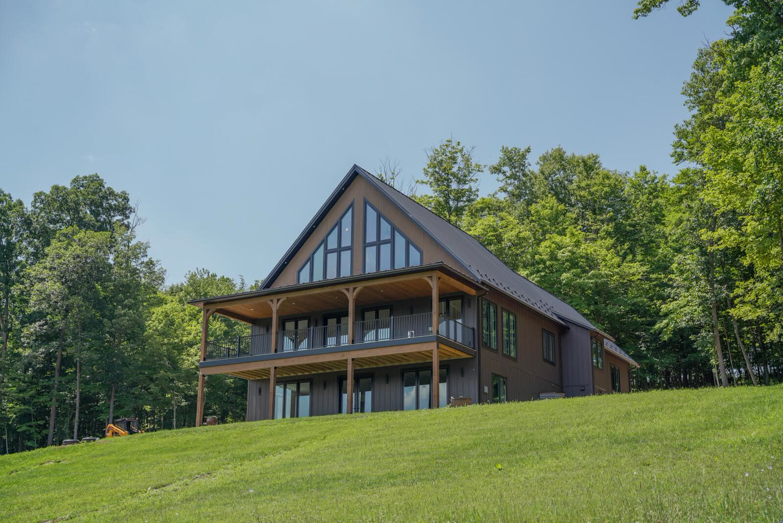 Daytime view of the Shetler Residence custom build with timber post-and-beam porch — KB Builders, Mifflintown, PA