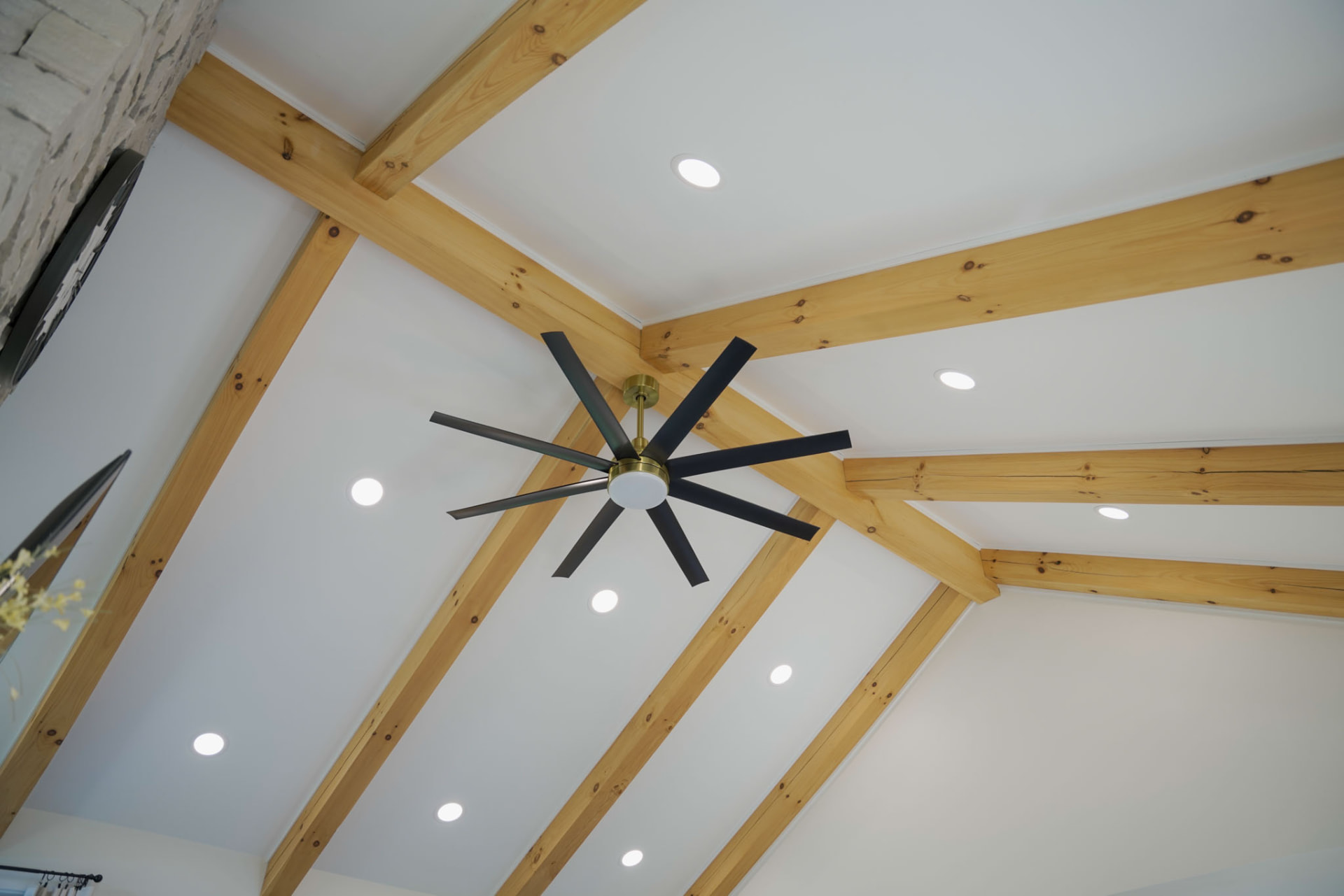 Yoder Residence — cathedral ceiling detail with exposed pine beams, recessed lighting, and black ceiling fan — KB Builders, Central Pennsylvania
